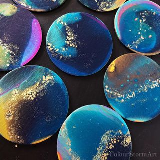 collection of circular coasters - blue and gold with glitter