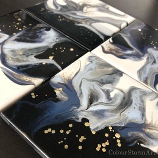 4 coasters - black and white with gold specks