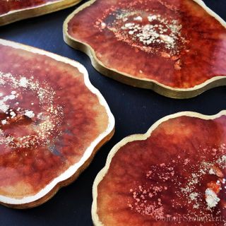 4 rock geode design coasters - earth red with white outline