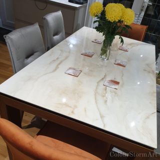 white marble table with 6 matching coasters